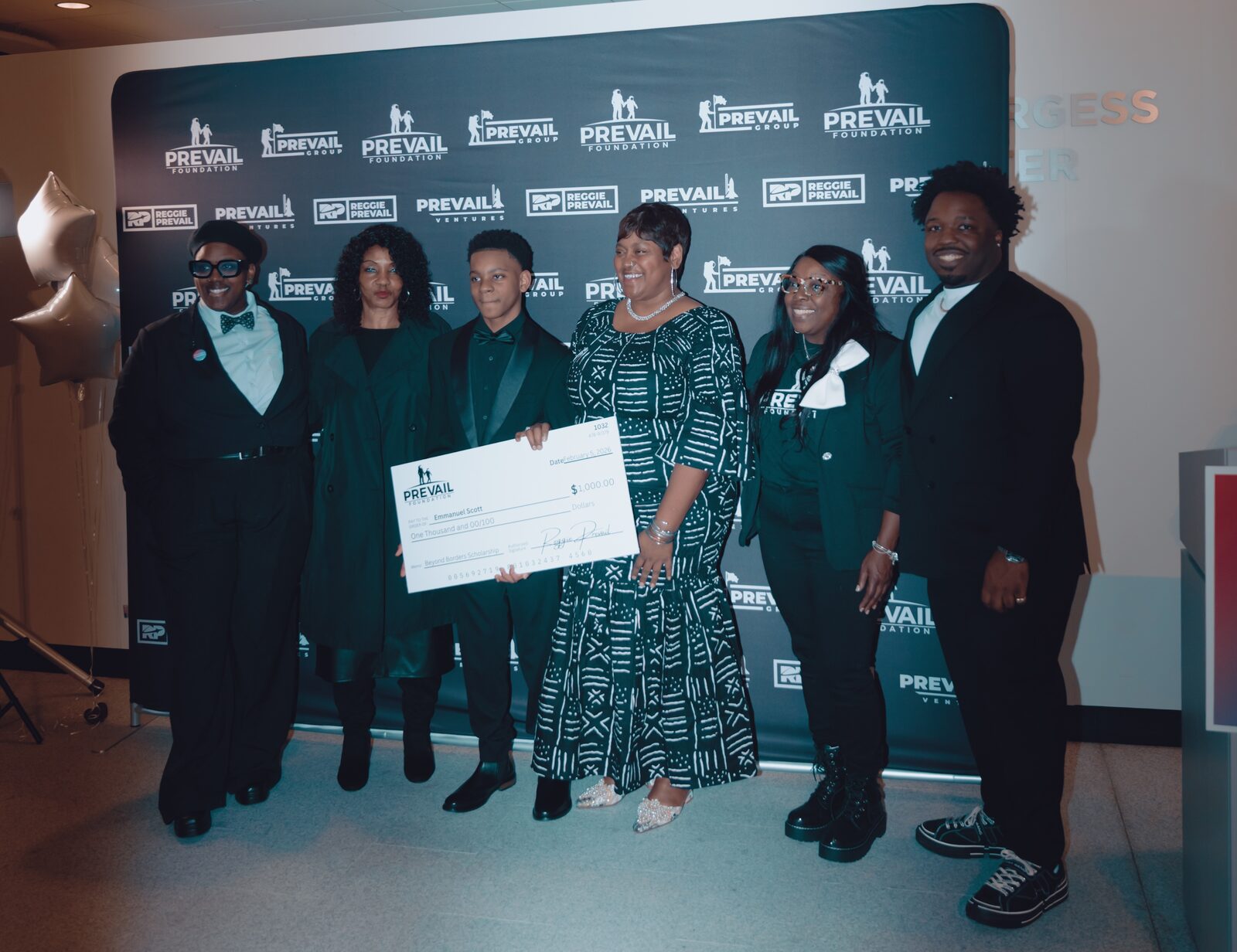 Emmanuel Scott with family and Reggie Prevail at the Beyond Borders launch